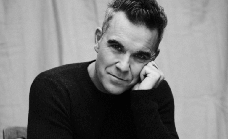 Robbie Williams rinde tributo a la música inglesa de los años 90 en ‘BRITPOP’